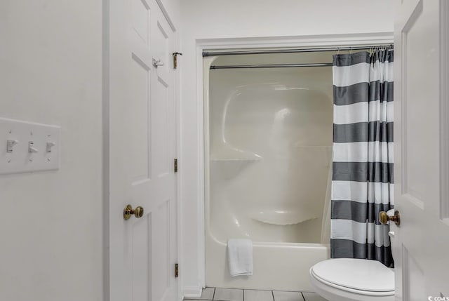 bathroom with shower / bath combination with curtain, toilet, and tile patterned flooring