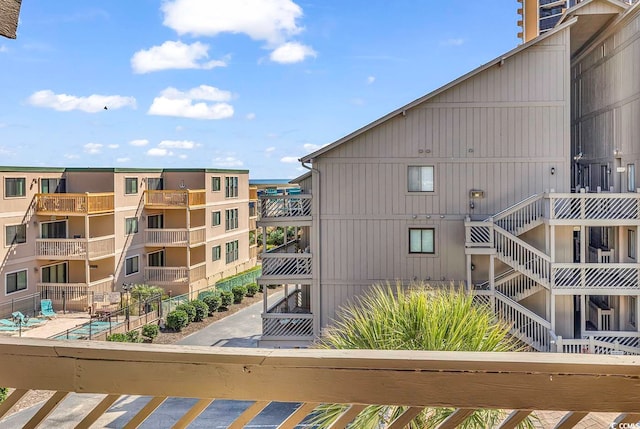 view of building exterior with a community pool