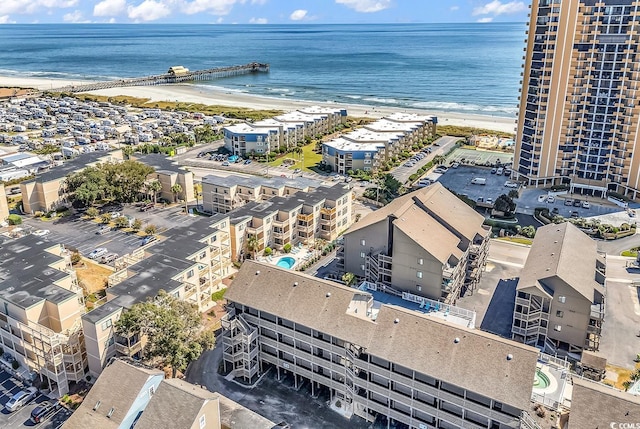 aerial view featuring a view of the beach and a water view