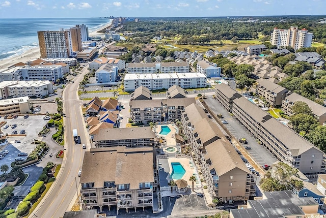 aerial view featuring a water view and a beach view