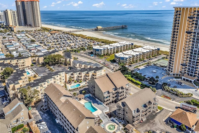 aerial view featuring a water view and a beach view