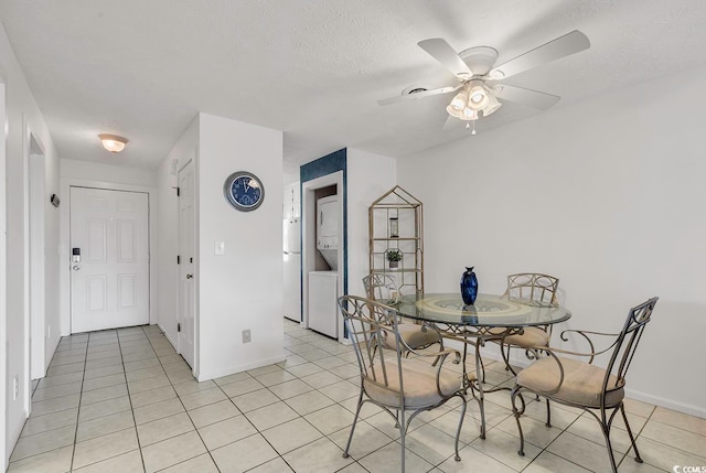 dining area featuring ceiling fan, a textured ceiling, and light tile patterned floors