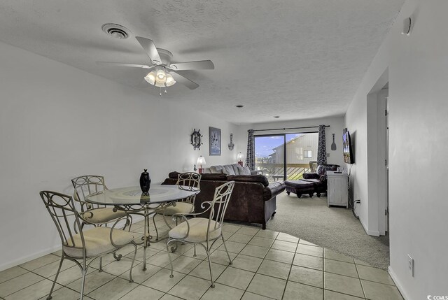 9621 Shore Dr Unit G219, Myrtle Beach, SC 29572 - dining space featuring light colored carpet, ceiling fan, light tile patterned floors, and a textured ceiling