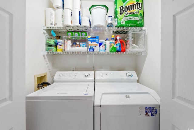 washroom featuring washer and clothes dryer