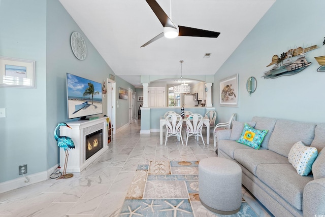 living room featuring ceiling fan and lofted ceiling