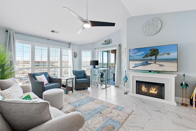 living room featuring vaulted ceiling and ceiling fan