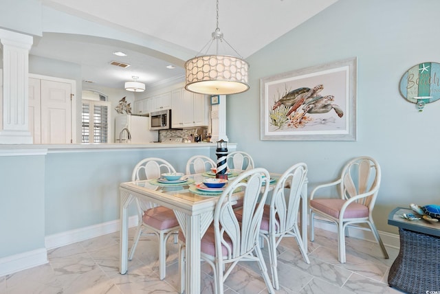 dining area with vaulted ceiling