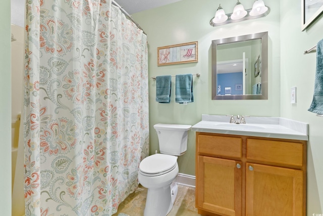 bathroom with vanity, toilet, and a shower with curtain