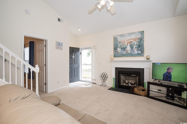 living room with high vaulted ceiling, light colored carpet, and ceiling fan