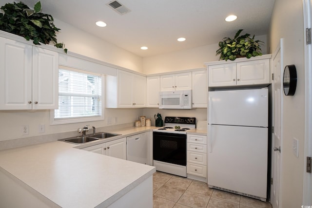 kitchen featuring white cabinetry, sink, white appliances, and light tile patterned floors