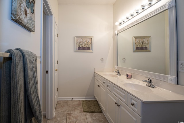 bathroom with tile patterned flooring and vanity