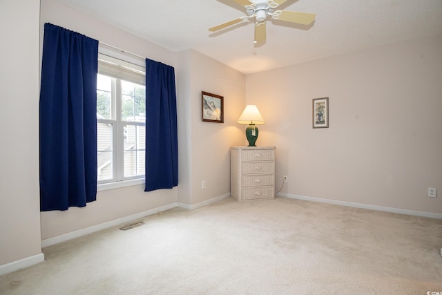 unfurnished bedroom with carpet floors and ceiling fan