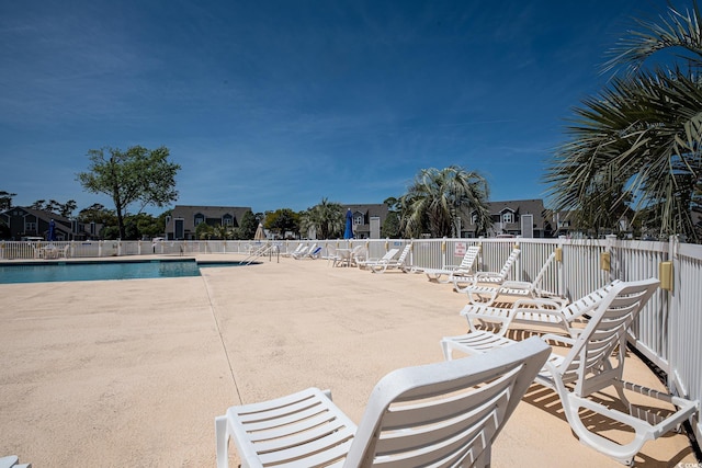 view of pool featuring a patio area