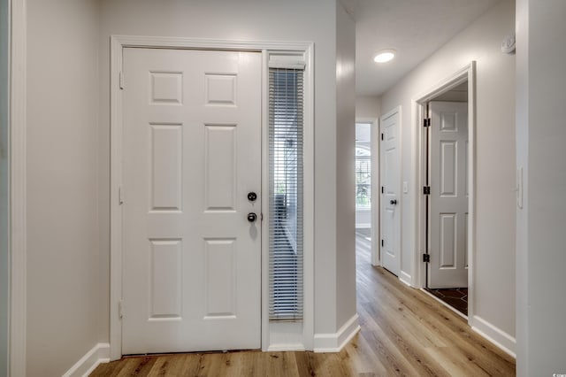 entryway with light hardwood / wood-style floors