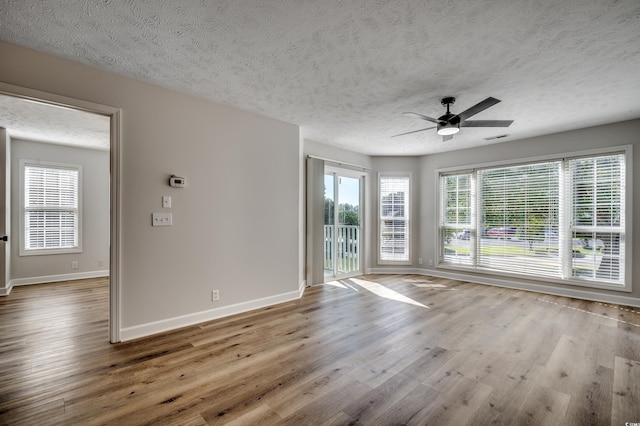 4641 Lightkeepers Way Unit 3-D, Little River, SC 29566 - spare room with baseboards, wood finished floors, a textured ceiling, and ceiling fan
