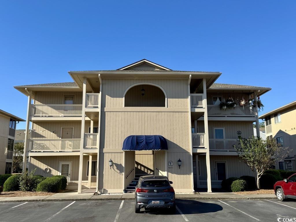 4278 Pinehurst Cir Unit W2, Little River, SC 29566 - view of building exterior with uncovered parking