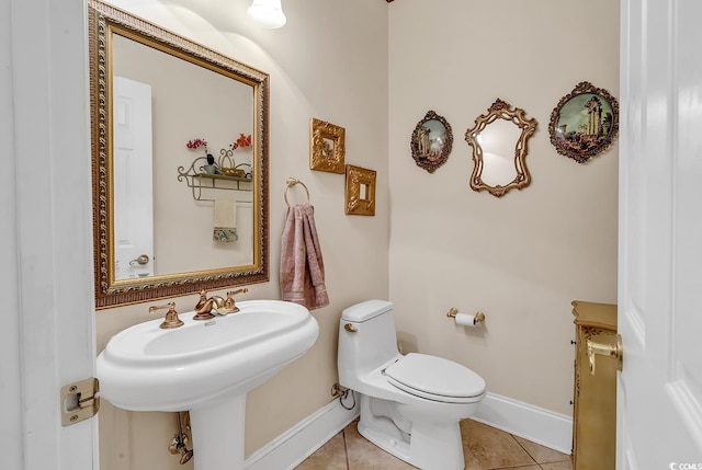 bathroom with tile patterned floors and toilet