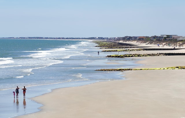 property view of water featuring a beach view