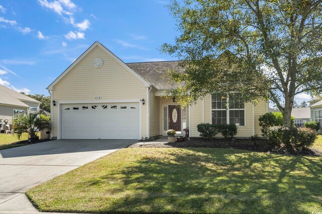 ranch-style home with a garage and a front lawn