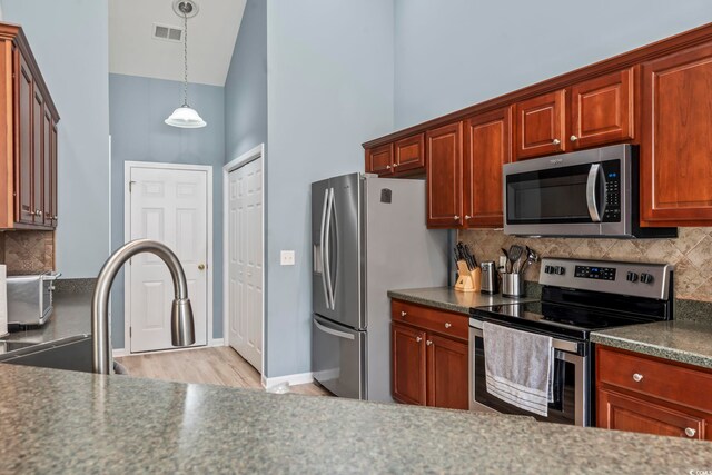 kitchen featuring backsplash, high vaulted ceiling, sink, stainless steel dishwasher, and ceiling fan