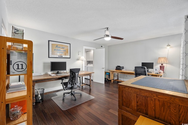 home office with ceiling fan, dark hardwood / wood-style flooring, a textured ceiling, and independent washer and dryer