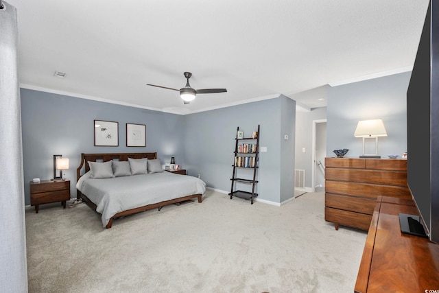 bedroom featuring ceiling fan, carpet, and ornamental molding