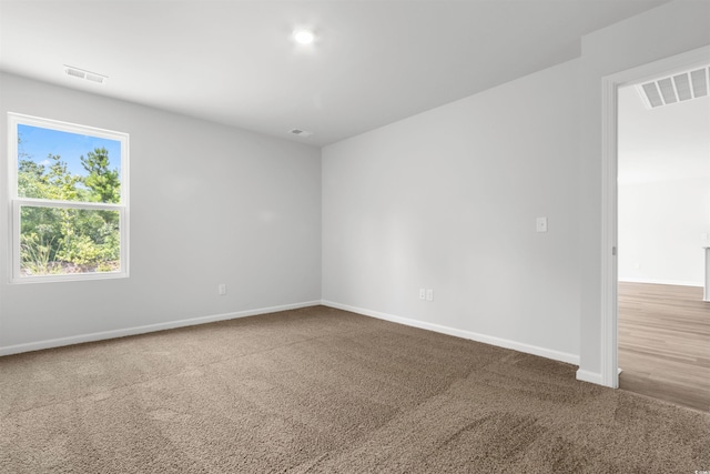 unfurnished room featuring carpet flooring