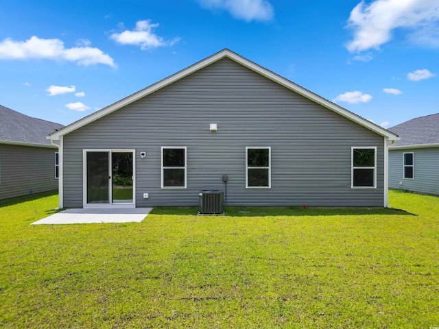 back of house featuring central air condition unit, a yard, and a patio