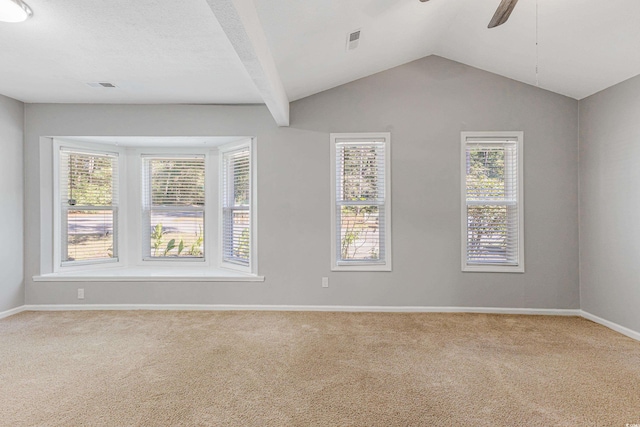 unfurnished room with vaulted ceiling, carpet floors, and ceiling fan