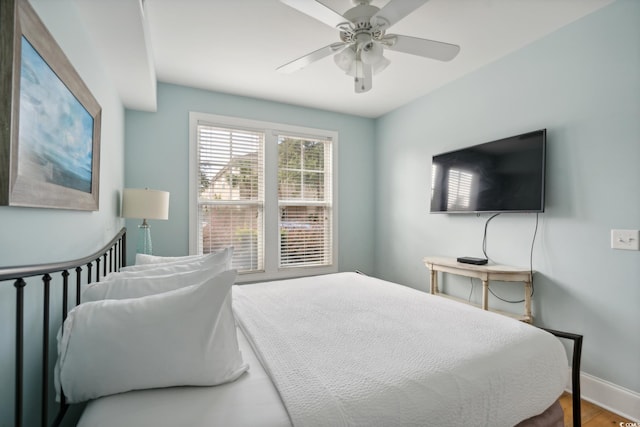 bedroom with hardwood / wood-style flooring and ceiling fan