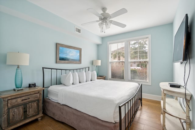 bedroom featuring ceiling fan and hardwood / wood-style flooring