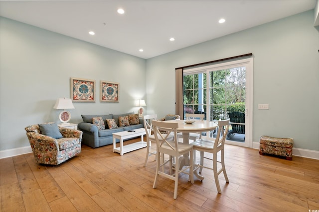 dining area featuring light wood-type flooring