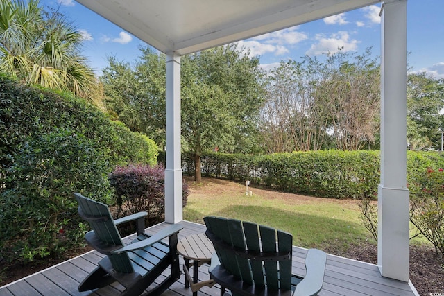 wooden deck with a yard