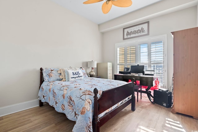 bedroom with hardwood / wood-style floors and ceiling fan