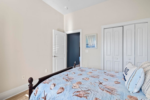 bedroom featuring light hardwood / wood-style flooring and a closet