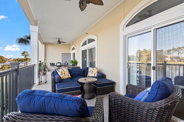 balcony with outdoor lounge area and ceiling fan