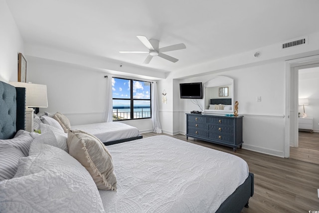 bedroom featuring hardwood / wood-style flooring and ceiling fan