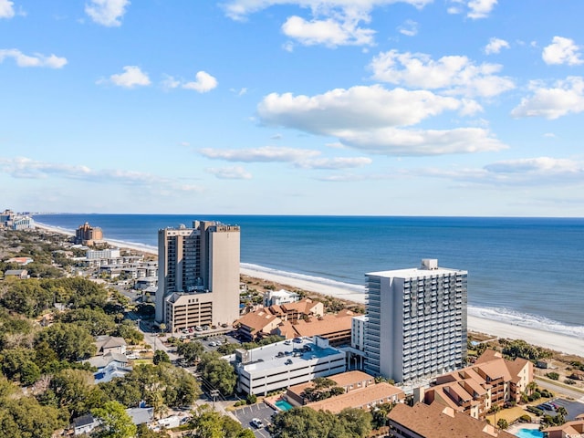 birds eye view of property featuring a water view and a view of the beach