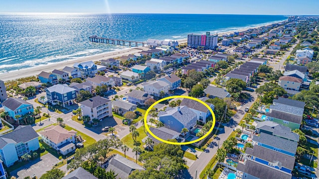 aerial view featuring a water view and a beach view