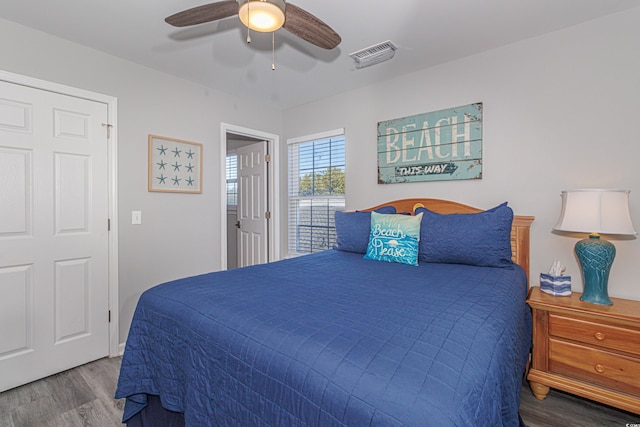 bedroom featuring hardwood / wood-style flooring and ceiling fan