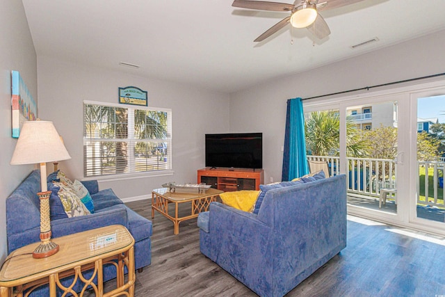 living room with ceiling fan and wood-type flooring