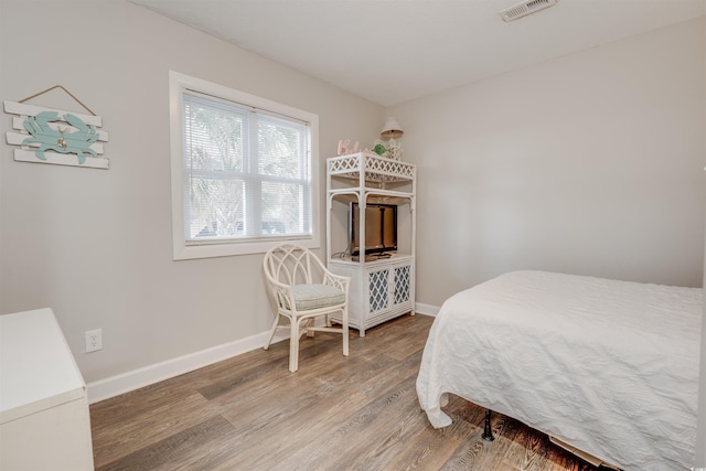 bedroom featuring wood-type flooring