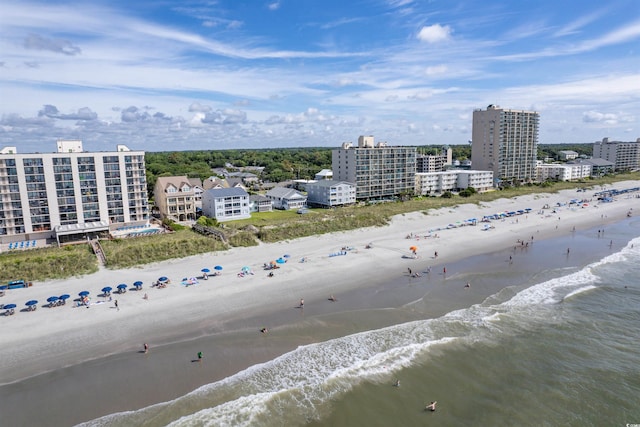 bird's eye view featuring a water view and a view of the beach