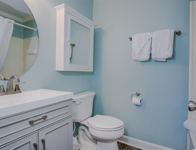 bathroom with toilet, a shower with curtain, hardwood / wood-style floors, crown molding, and vanity