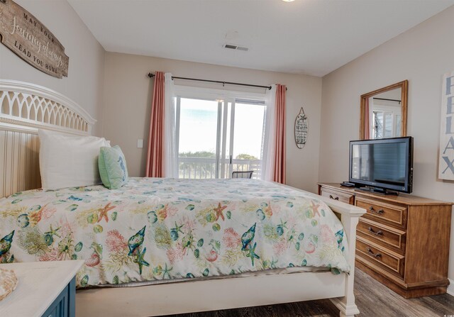 bedroom with access to exterior and light wood-type flooring