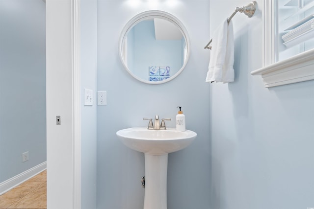 bathroom with sink and tile patterned flooring