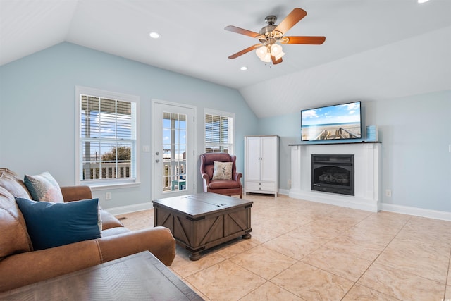 tiled living room featuring lofted ceiling and ceiling fan