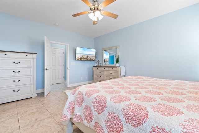 tiled bedroom featuring ceiling fan