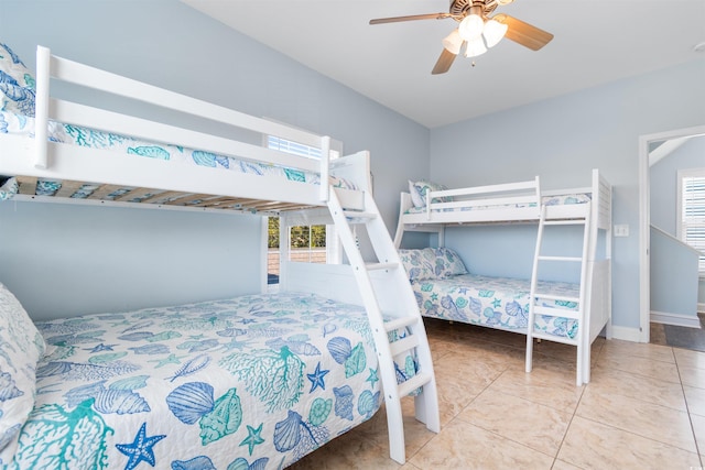 bedroom with tile patterned flooring and ceiling fan