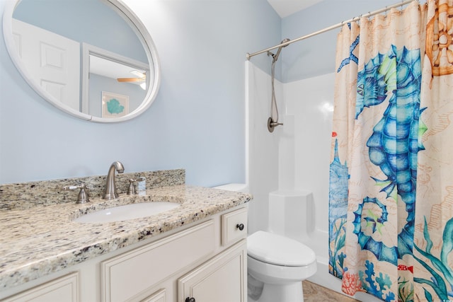 full bathroom with vanity, toilet, and shower / tub combo